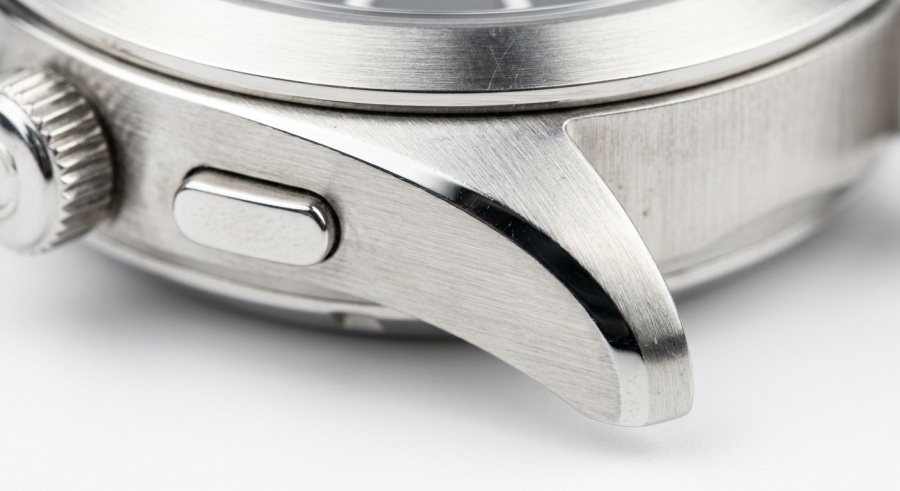 Business Steel Watches – Professional, Polished & Boardroom-Ready Every Day firefly gemini flash extreme close up of a stainless steel watch case surface, showing fine metal texture 221213