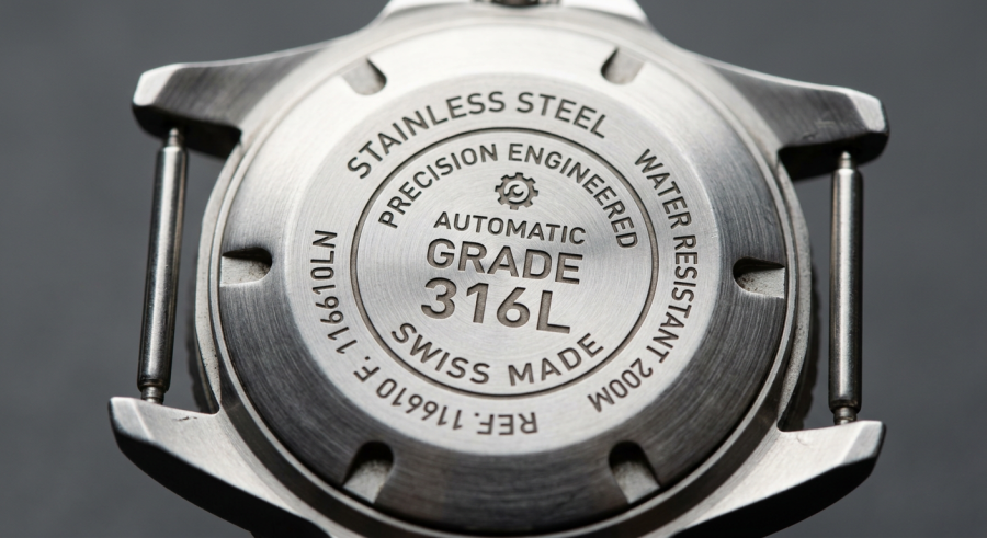 Business Steel Watches – Professional, Polished & Boardroom-Ready Every Day firefly gemini flash macro shot of a watch case back engraved with steel grade markings, stainless steel t 221213
